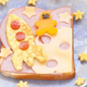 Sandwich with rocket ship made of egg and astronaut made of sweet potato